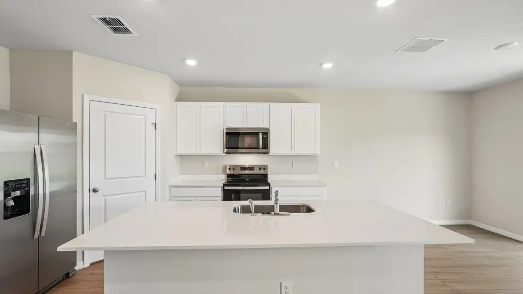 Representative furnished interior of a home built from the Hayden by D.R. Horton in Pinellas County Spot Lots, Pinellas Park (Image 4).