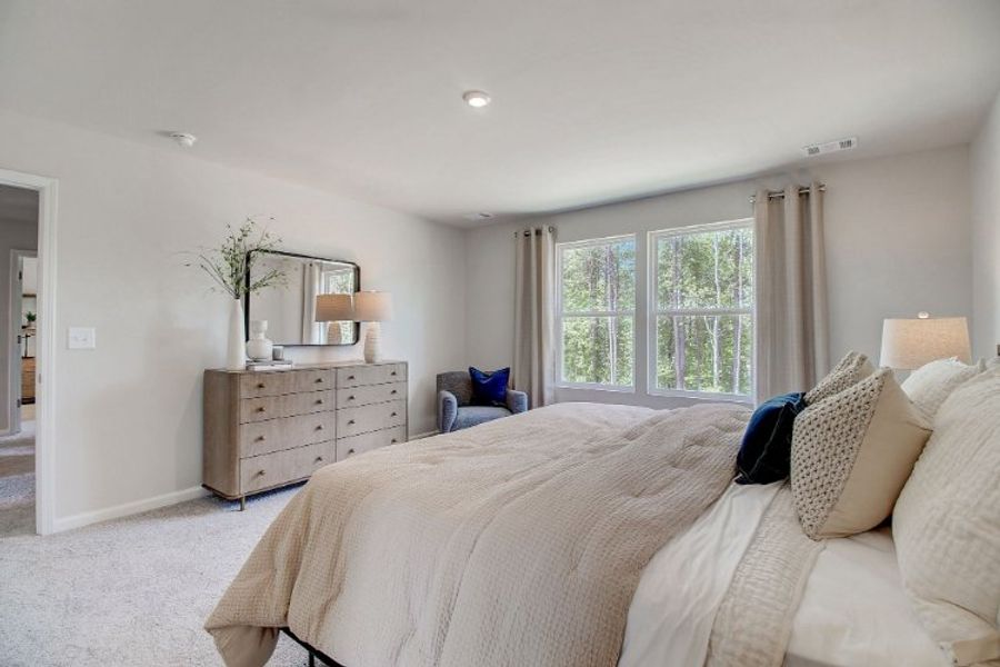 A bedroom with a bed and a dresser. A bedroom with a bed and a dresser.