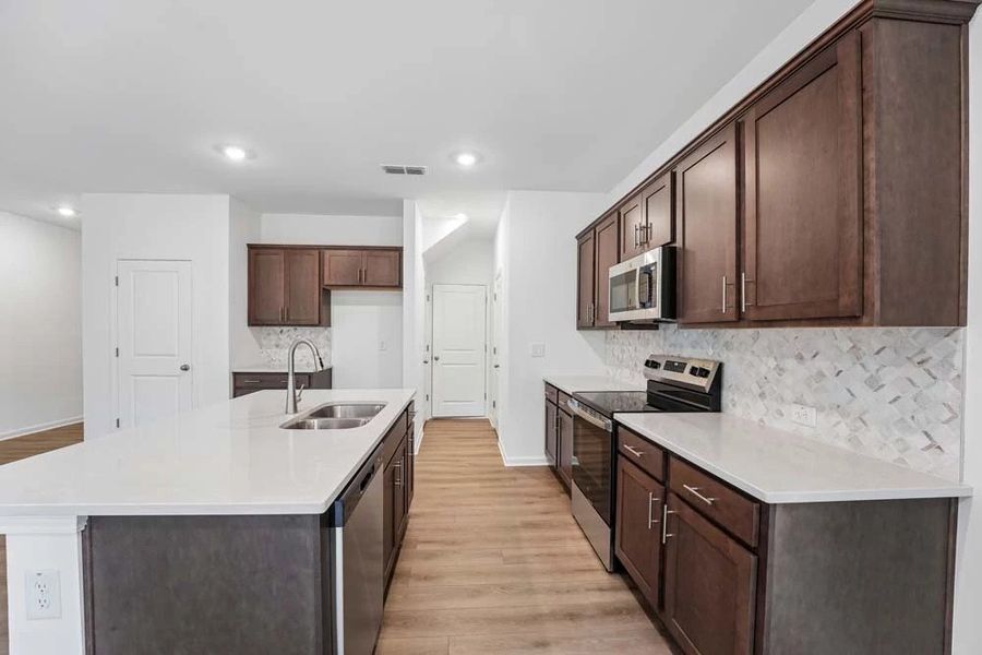 Kitchen Featuring Roosevelt Collection Finishes