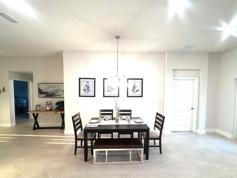 Dinning - Model Home. "Finishes may vary."