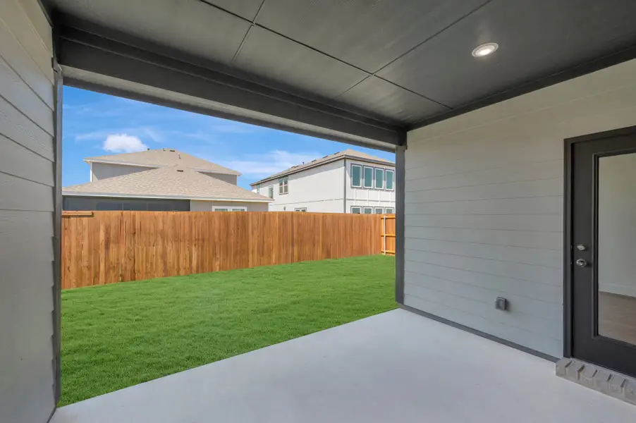 Exterior details and patio area of a home in The Meadows, Denton (Image 18).