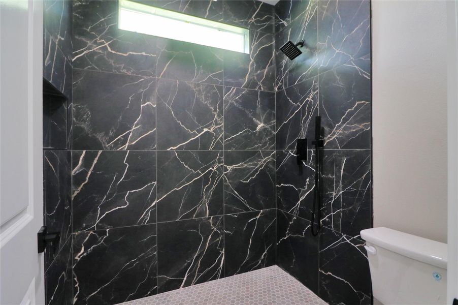 Primary bath walk in double size shower. Primary bath walk in double size shower.