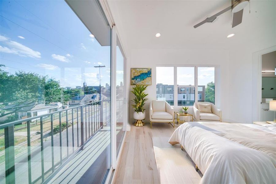 Bedroom with ceiling fan, light hardwood / wood-style floors, and access to exterior