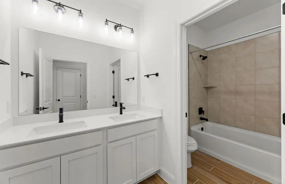 Furnished interior view inside a new home in 6 Creeks, Kyle (Image 3).