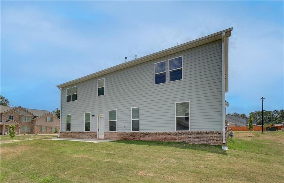 Exterior details and patio area of a home in Berkeley Lakes, Locust Grove (Image 4).