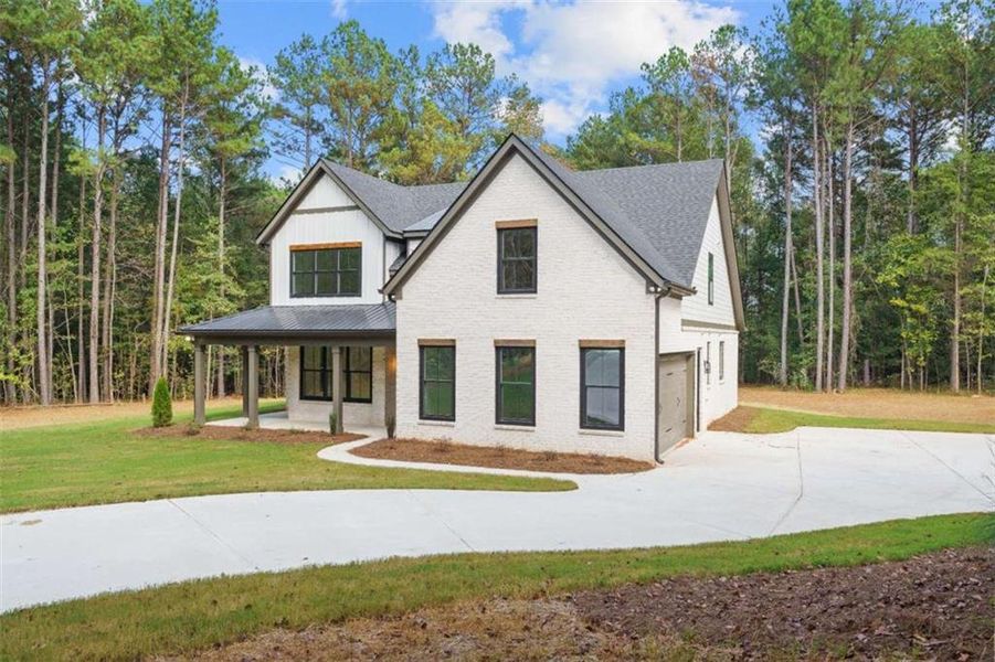Front exterior of a new home in , Jenkinsburg, GA, highlighting curb appeal (Image 33).