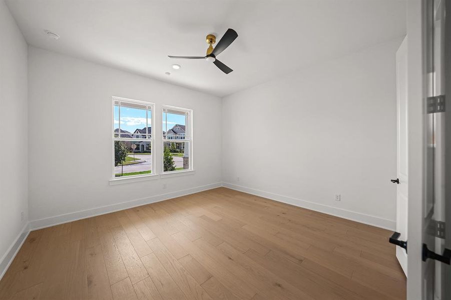 Spare room featuring light wood finished floors, recessed lighting, and a ceiling fan