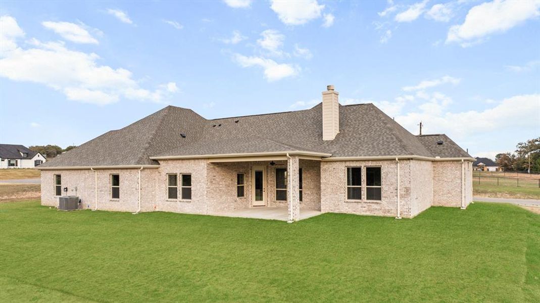 Large covered patio facing the tree lined creek. Large covered patio facing the tree lined creek.