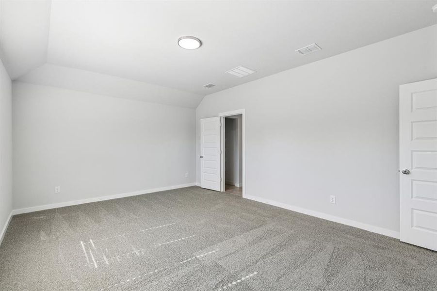 Primary Suite in the Oscar home plan by Trophy Signature Homes – REPRESENTATIVE PHOTO