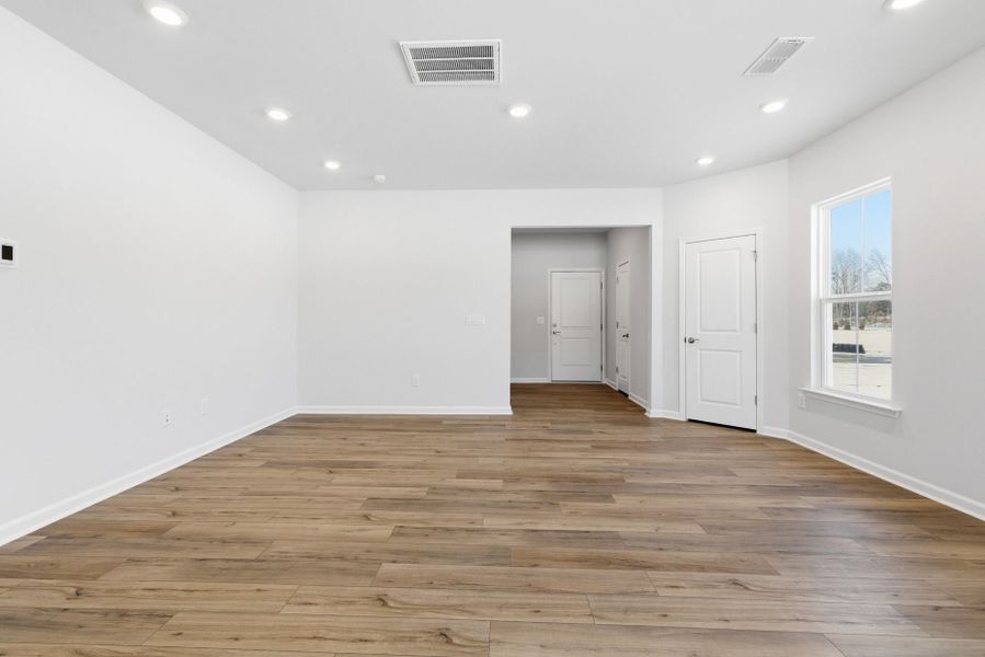 Spacious, unfurnished interior of a new home in Poets Walk, Whitsett (Image 49).