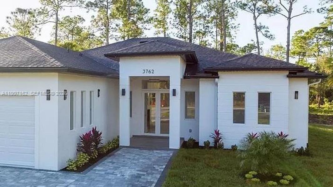 Front exterior of a new home in , Naples, FL, highlighting curb appeal (Image 29).
