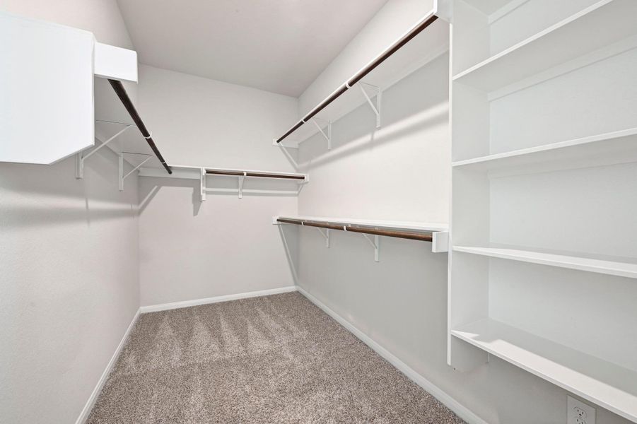 Spacious primary walk-in closet
