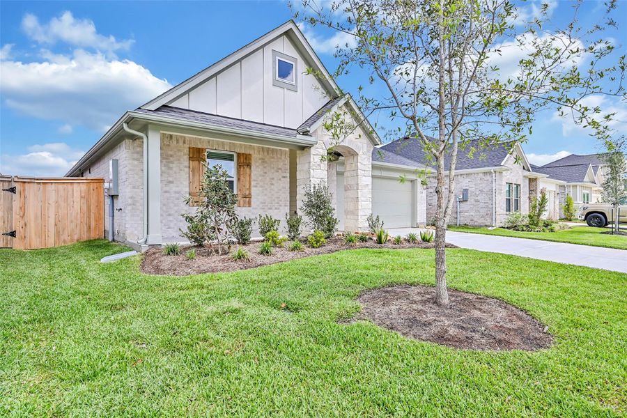 Front exterior of a new home in Laurel Landing, Alvin, TX, highlighting curb appeal (Image 20).