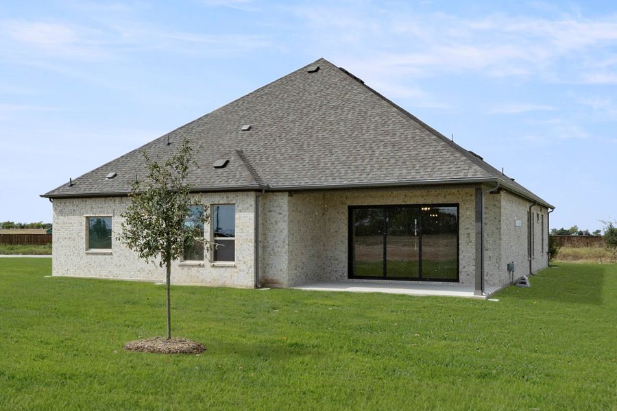 Exterior details and patio area of a home in Settler's Glen, New Fairview (Image 3).