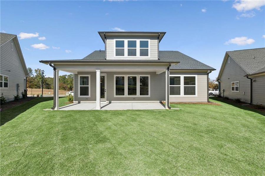 Exterior details and patio area of a home in Crescent Pointe at Great Sky, Canton (Image 4).