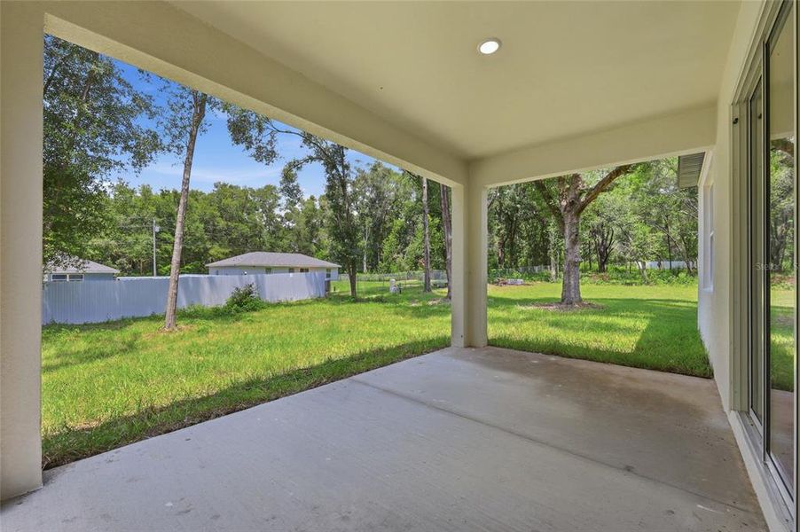 Exterior details and patio area of a home in , Summerfield (Image 20).