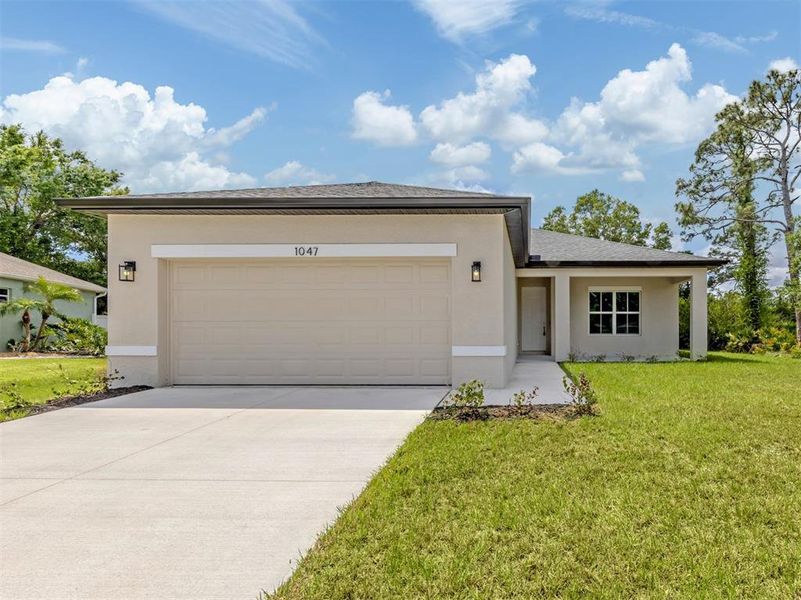 Front exterior of a new home in , North Port, FL, highlighting curb appeal (Image 2).