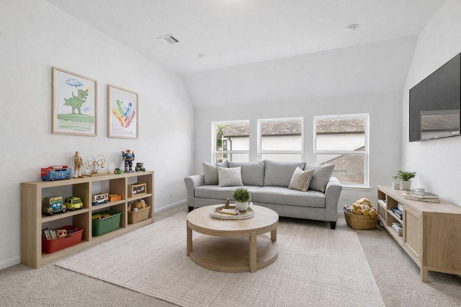 Spacious and inviting game room, staged to provide an example perfect for relaxation and entertainment, featuring cozy seating and ample natural light. Spacious and inviting game room, staged to provide an example perfect for relaxation and entertainment, featuring cozy seating and ample natural light.