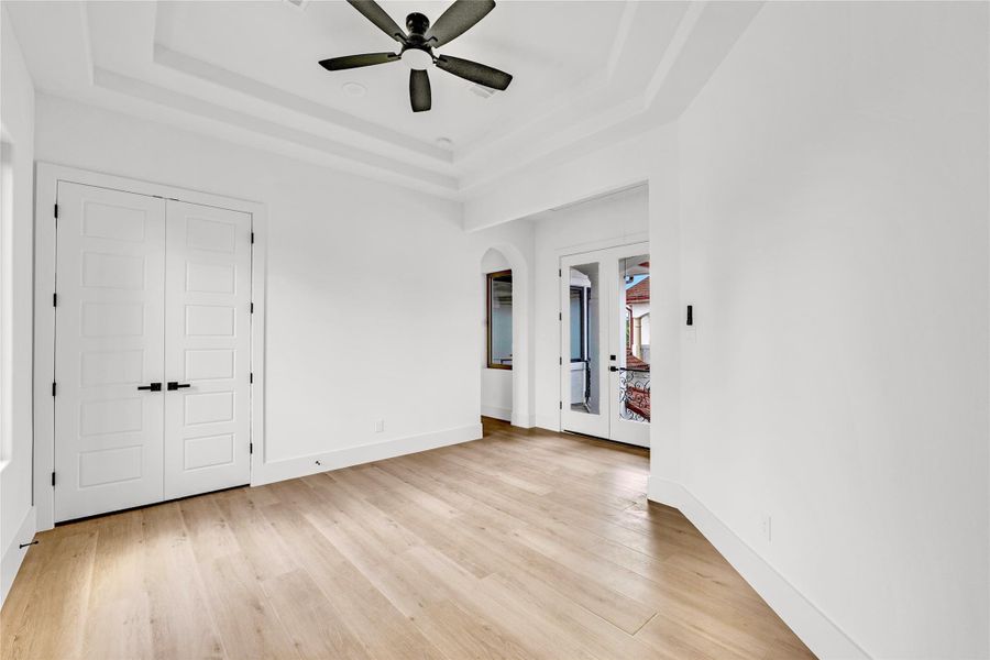 The game room has double doors going out to the wrap-around balcony.