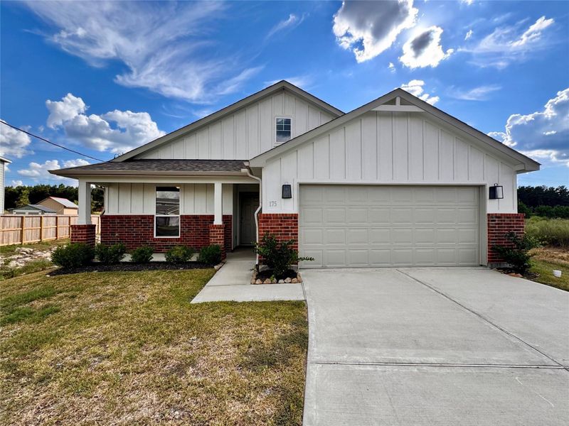 Front exterior of a new home in , Cleveland, TX, highlighting curb appeal (Image 2).