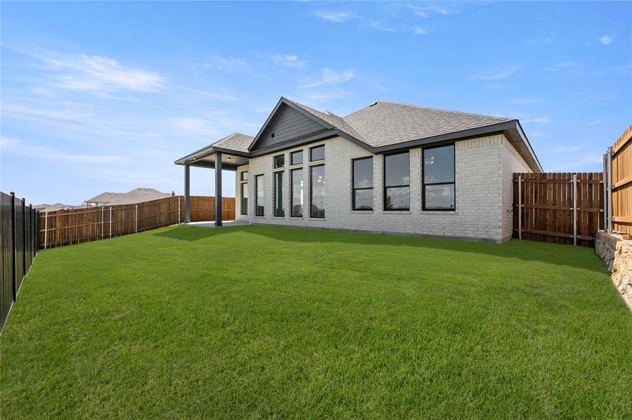 Exterior details and patio area of a home in The Parks at Panchasarp Farms - Phase 3, Burleson (Image 16). Exterior details and patio area of a home in The Parks at Panchasarp Farms - Phase 3, Burleson (Image 16).