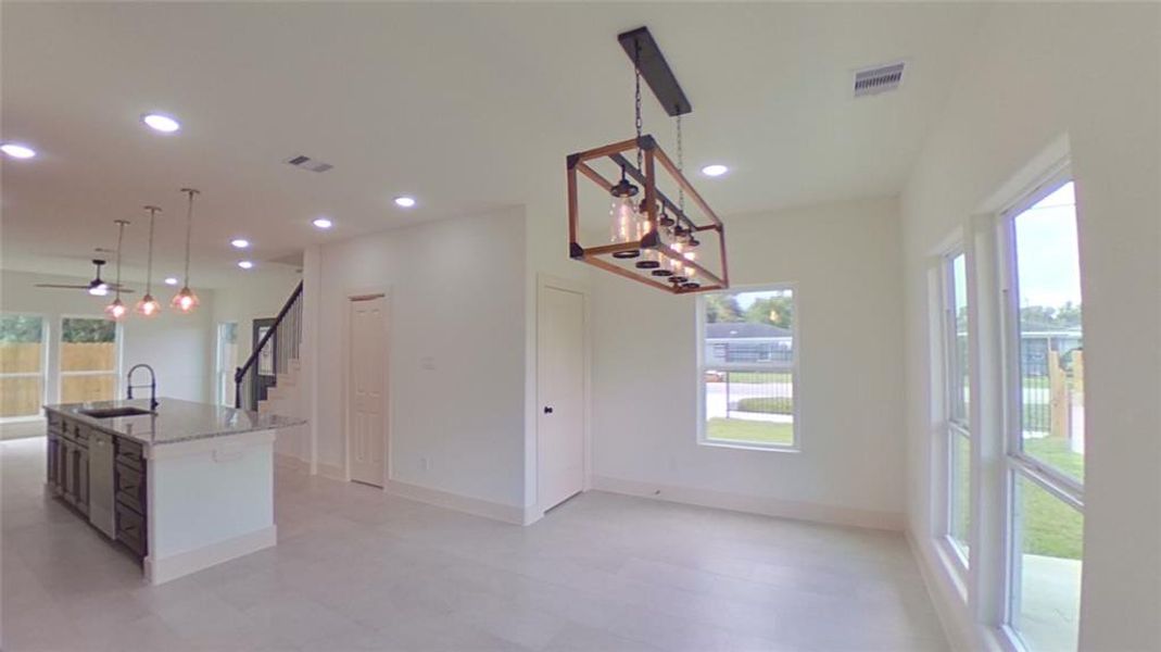 4209 Tampico St.A bright sophisticated dining room area that leads to the covered patio.