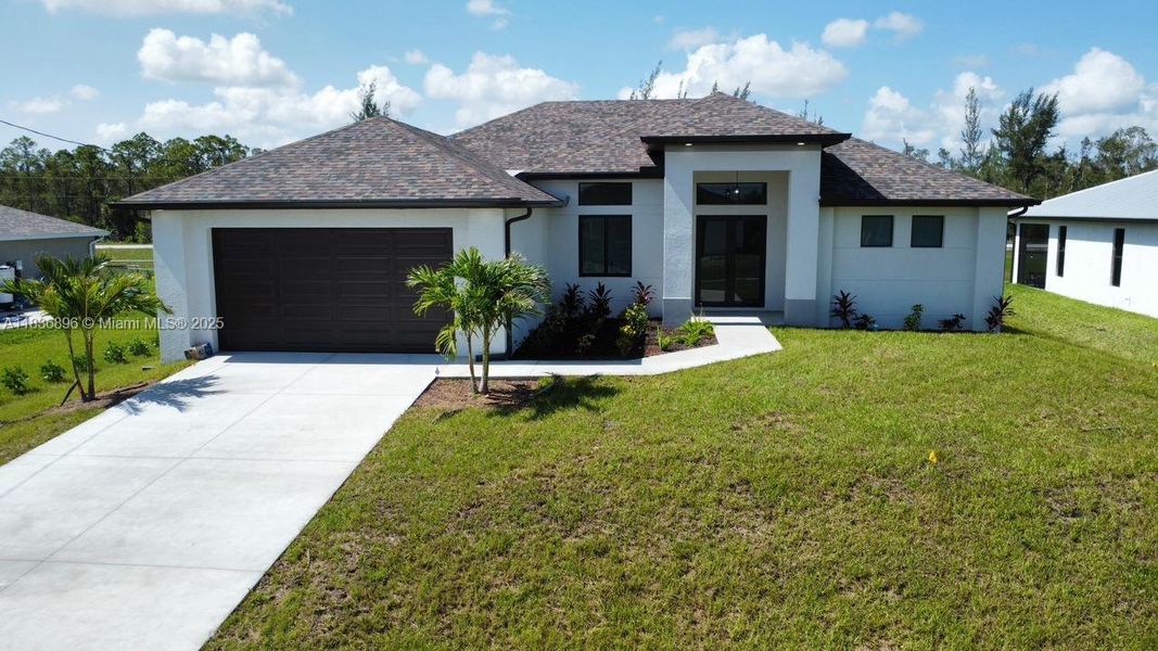 Front exterior of a new home in , Cape Coral, FL, highlighting curb appeal (Image 1).