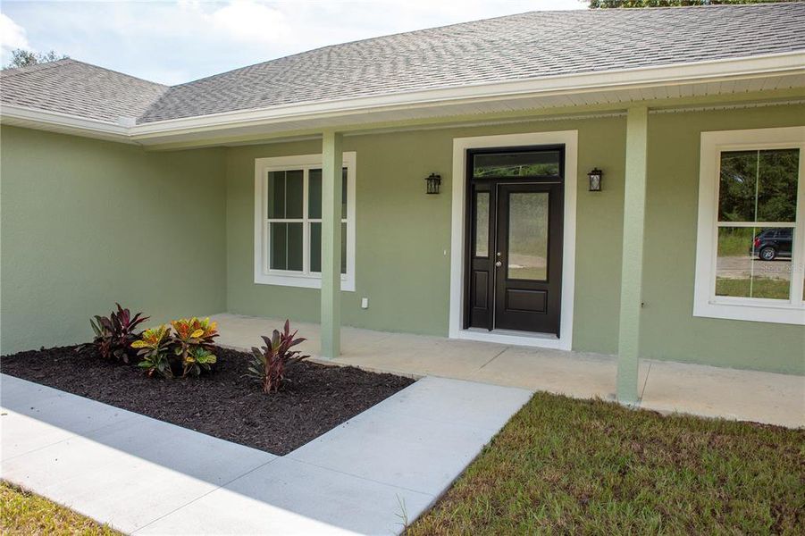 Front exterior of a new home in , Citrus Springs, FL, highlighting curb appeal (Image 26).