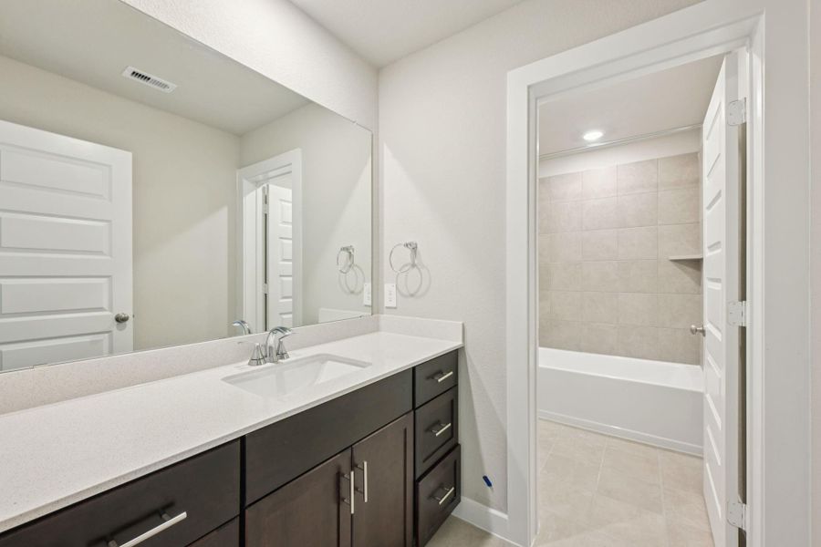 Furnished interior view inside a new home in Sundance Cove - Premier Series, Crosby (Image 11).