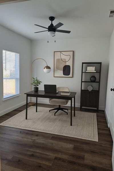 Office space featuring dark wood-type flooring and a ceiling fan