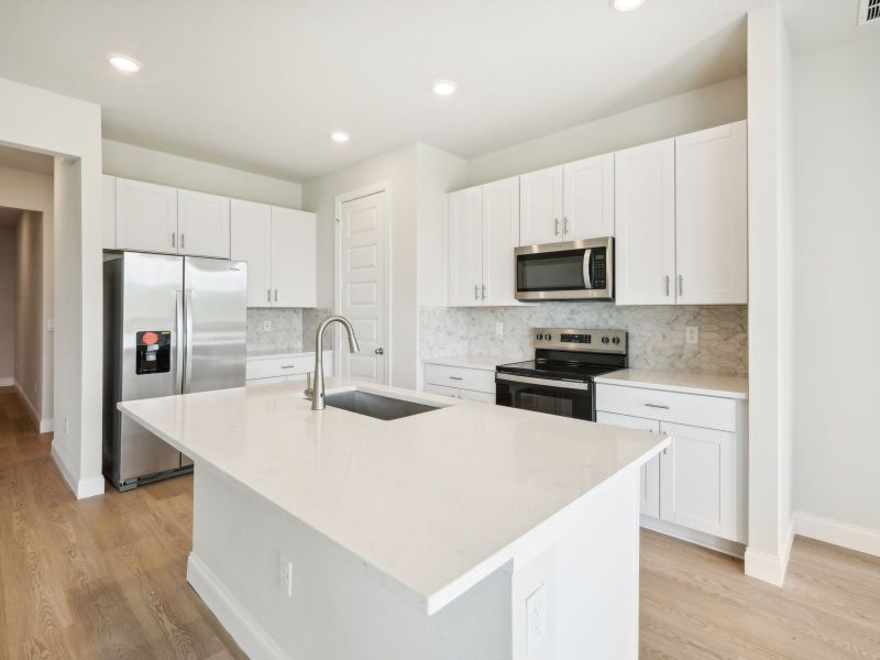 Kitchen in the Bergamo floorplan at 11306 NW Firefly Court