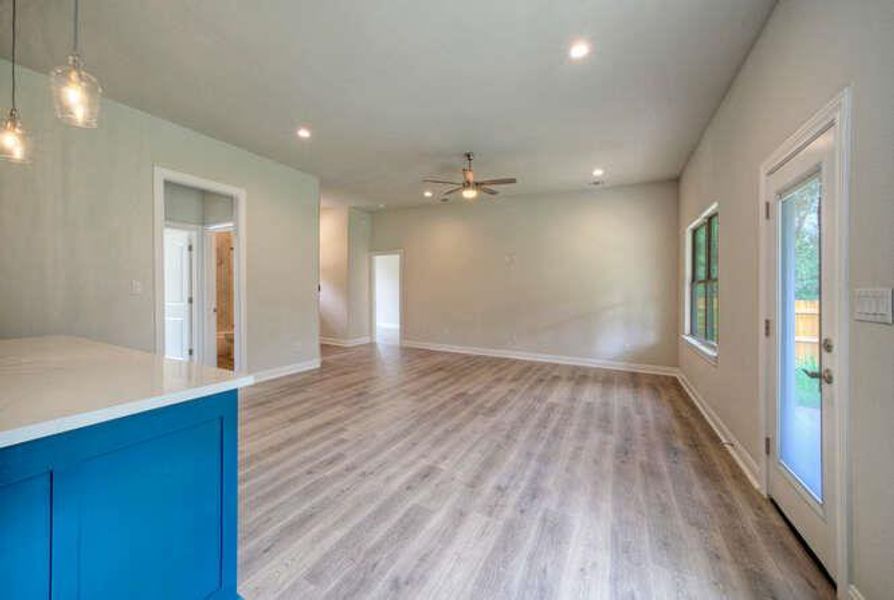 Unfurnished living room featuring light wood-type flooring, recessed lighting, and ceiling fan