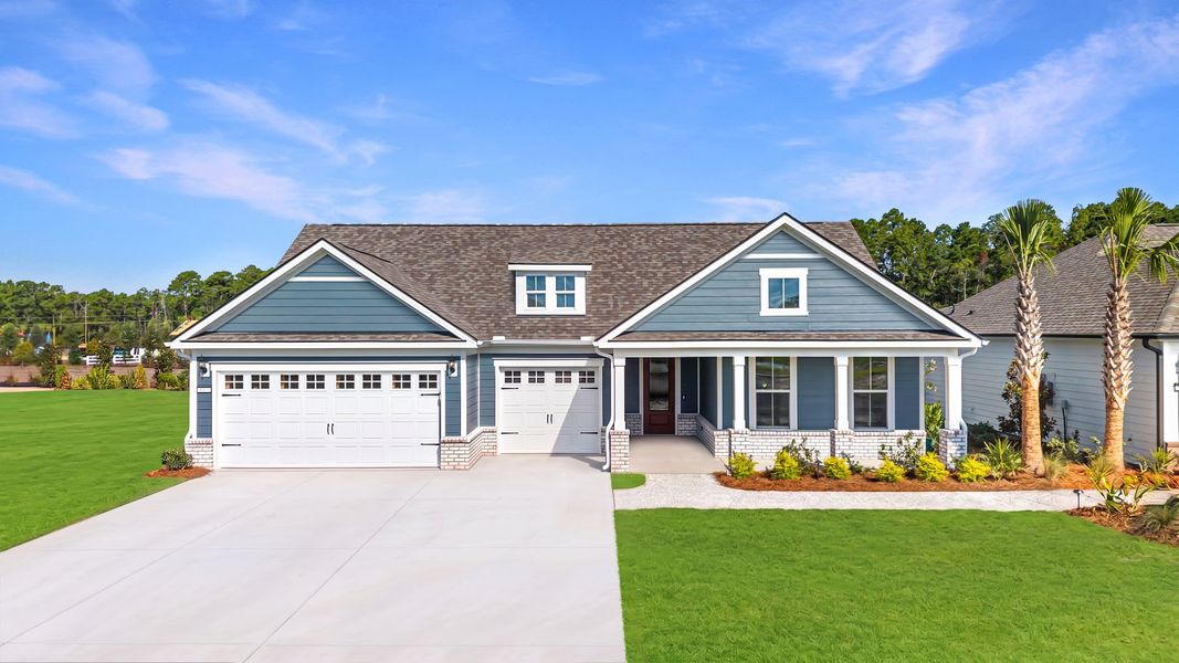 Front exterior of a new home in Del Webb Ocean Isle Beach, Shallotte, NC, highlighting curb appeal (Image 14).