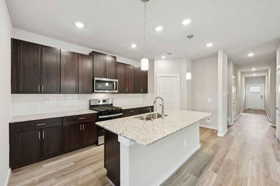 Furnished interior view inside a new home in Heights of Barbers Hill, Mont Belvieu (Image 4).