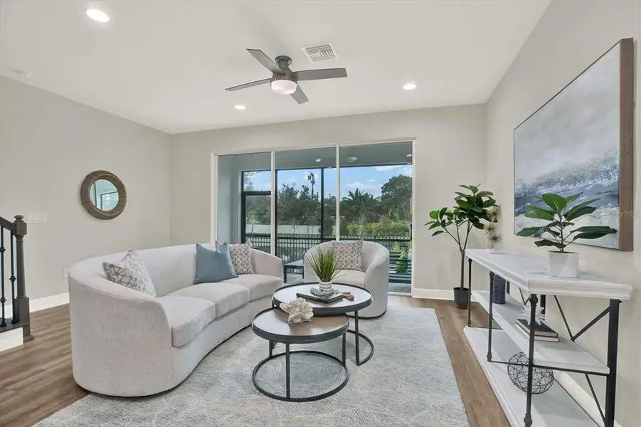 Furnished interior view inside a new home in The Towns At Long Bayou, Seminole (Image 6).