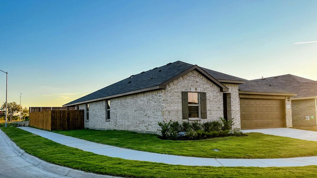 Front exterior of a new home in Sunnycreek, Fort Worth, TX, highlighting curb appeal (Image 2).