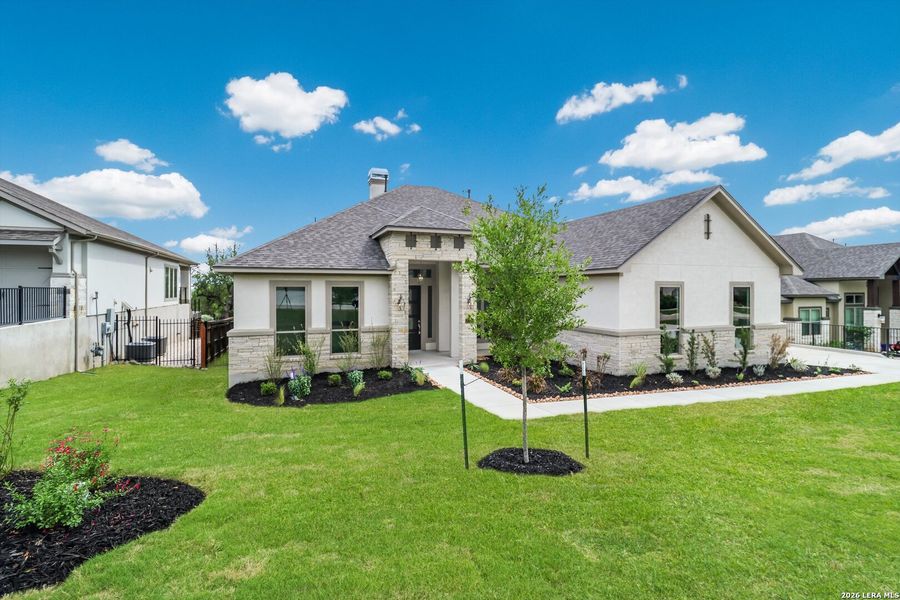 Front exterior of a new home in Johnson Ranch, Bulverde, TX, highlighting curb appeal (Image 2). Front exterior of a new home in Johnson Ranch, Bulverde, TX, highlighting curb appeal (Image 2).