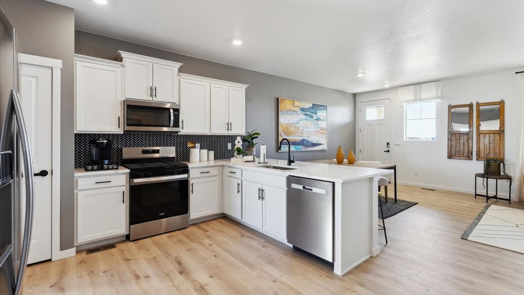 Furnished interior view inside a new home in Horizon Uptown, Aurora (Image 3).