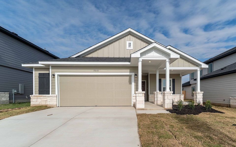 Front exterior of a new home in Hunters Glen, Jarrell, TX, highlighting curb appeal (Image 1). Front exterior of a new home in Hunters Glen, Jarrell, TX, highlighting curb appeal (Image 1).