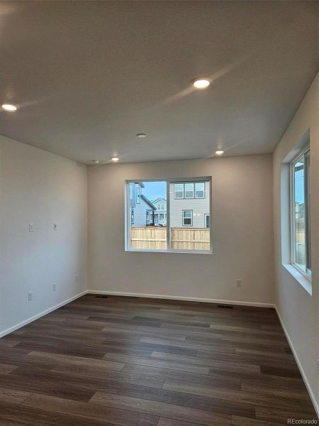 Spacious, unfurnished interior of a new home in The Cottages Collection at Ridgeline Vista, Brighton (Image 9).