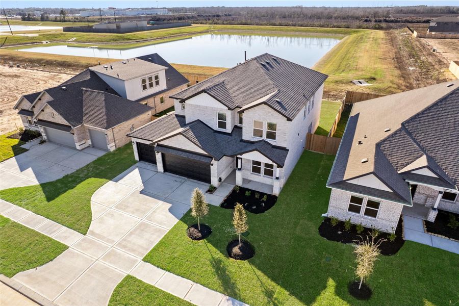 Front exterior of a new home in , Manvel, TX, highlighting curb appeal (Image 22).