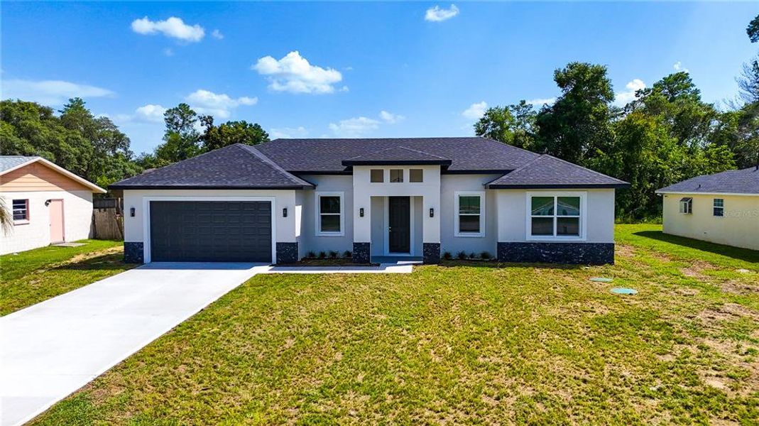 Front exterior of a new home in , Ocala, FL, highlighting curb appeal (Image 26).