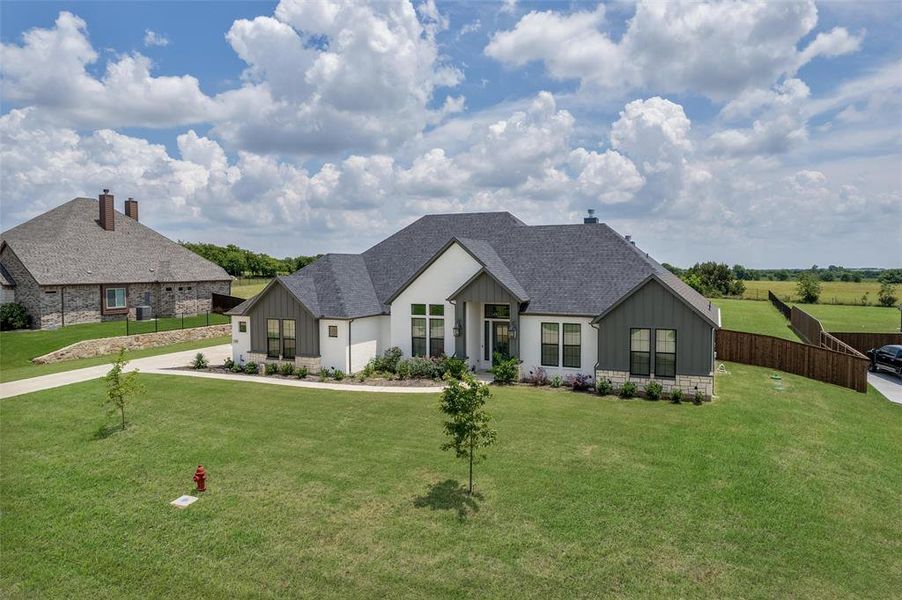 Front exterior of a new home in , Waxahachie, TX, highlighting curb appeal (Image 22). Front exterior of a new home in , Waxahachie, TX, highlighting curb appeal (Image 22).