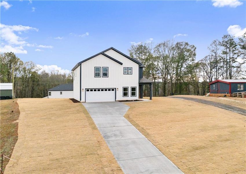 Front exterior of a new home in , Jefferson, GA, highlighting curb appeal (Image 27).