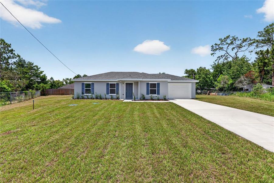 Front exterior of a new home in , Ocala, FL, highlighting curb appeal (Image 1). Front exterior of a new home in , Ocala, FL, highlighting curb appeal (Image 1).