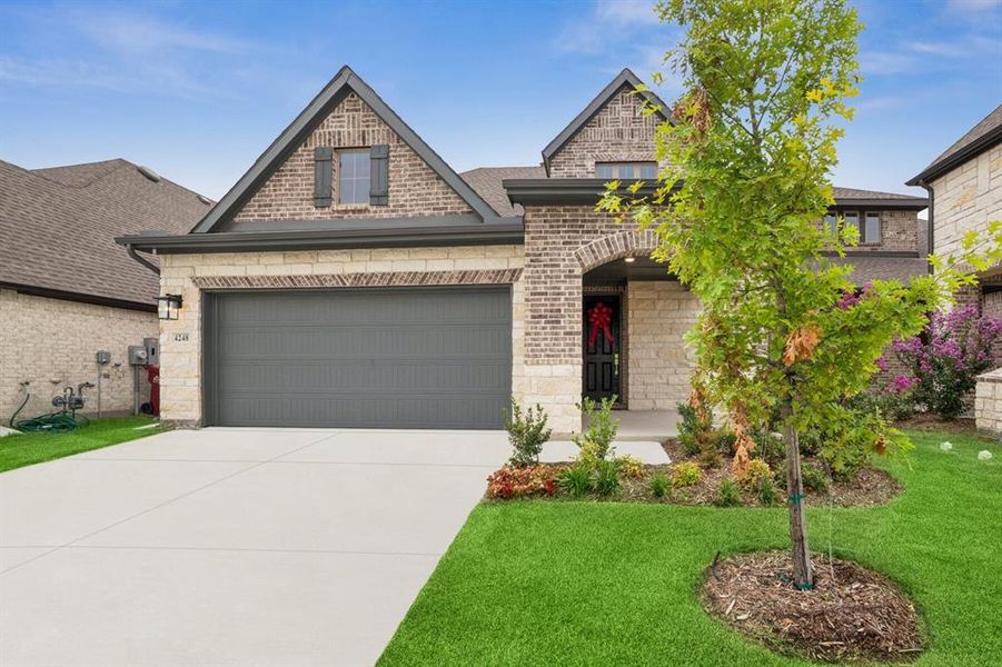 Front exterior of a new home in Creekshaw – Gardens, Royse City, TX, highlighting curb appeal (Image 1). Front exterior of a new home in Creekshaw – Gardens, Royse City, TX, highlighting curb appeal (Image 1).