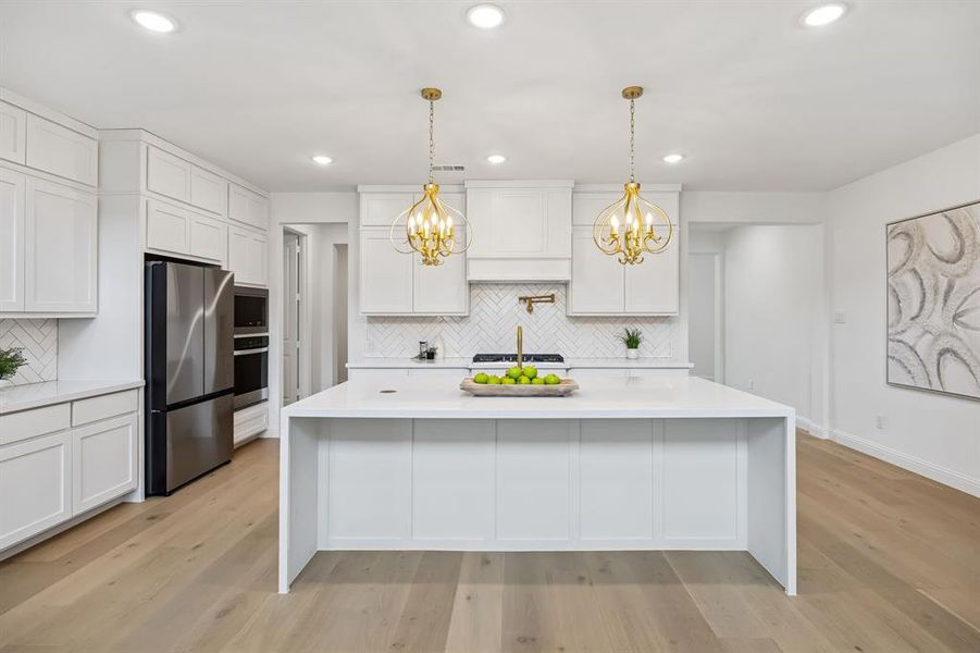 Elegant quartz countertops, stacked cabinetry, upgraded appliances. Elegant quartz countertops, stacked cabinetry, upgraded appliances.