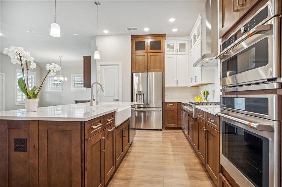 Remarkable kitchen featuring an island, gourmet amenities, ample storage, and generous countertop space.