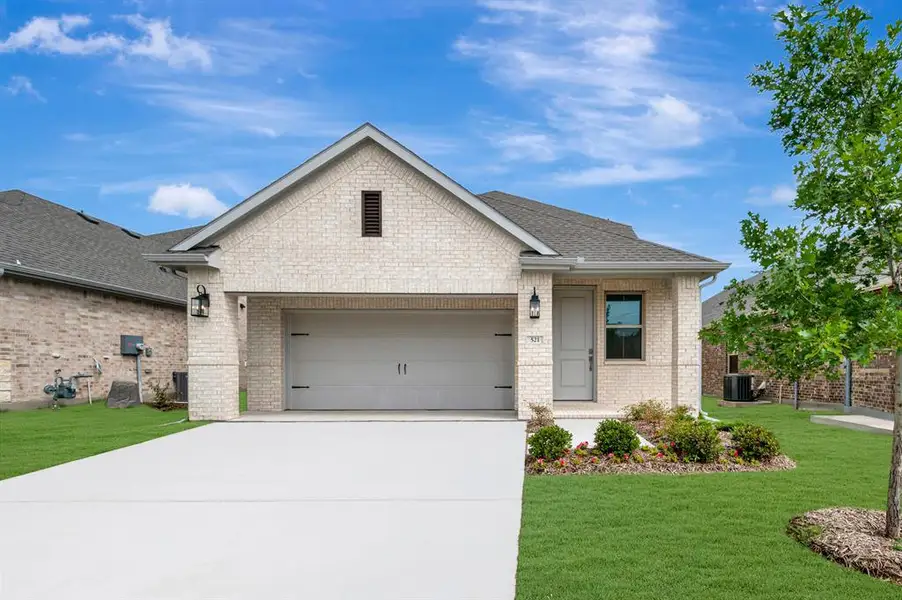 Front exterior of a new home in Heritage Ranch, Sherman, TX, highlighting curb appeal (Image 1). Front exterior of a new home in Heritage Ranch, Sherman, TX, highlighting curb appeal (Image 1).
