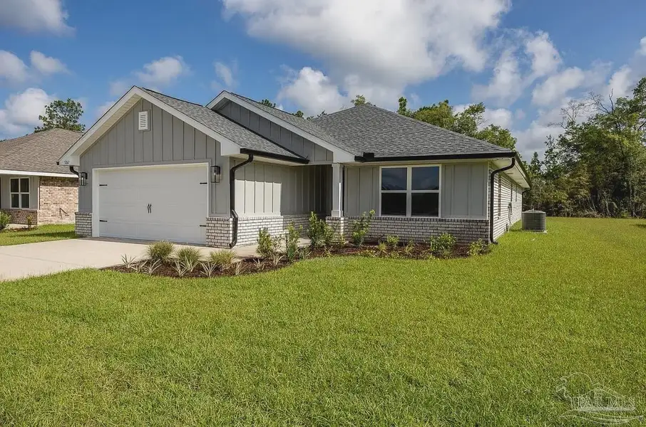 Front exterior of a new home in Hidden Pines, Milton, FL, highlighting curb appeal (Image 1). Front exterior of a new home in Hidden Pines, Milton, FL, highlighting curb appeal (Image 1).